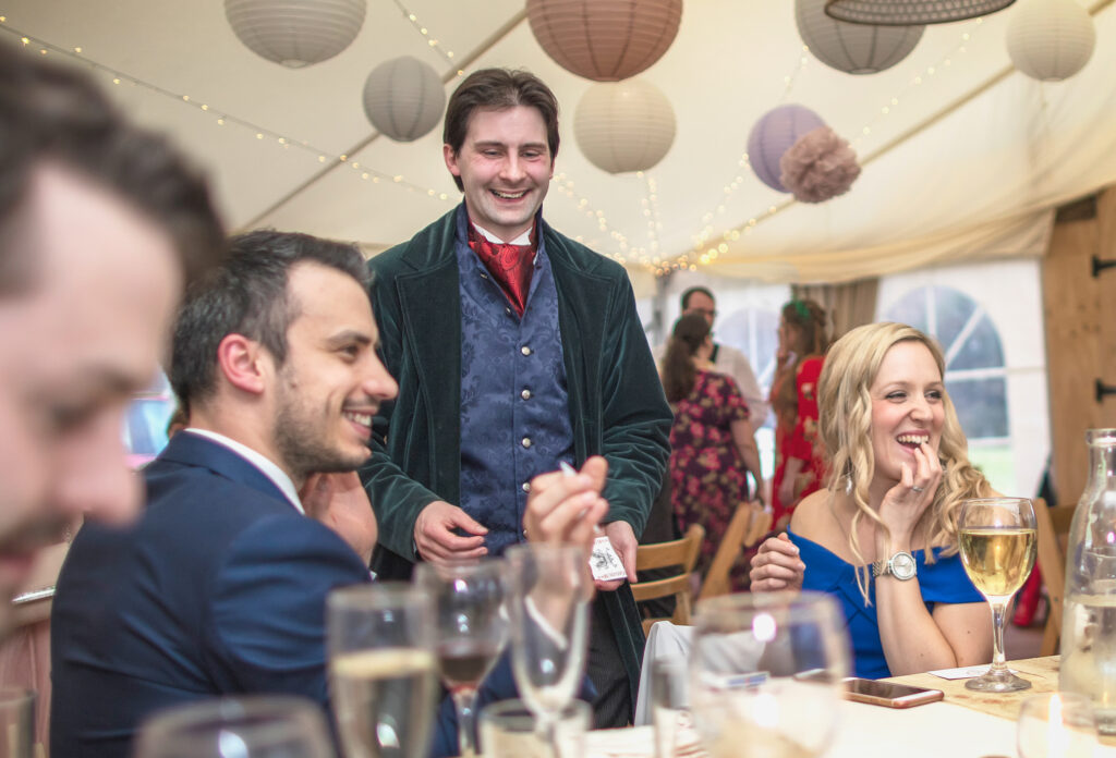 Wedding guests react to a magic trick from Jay Gatling